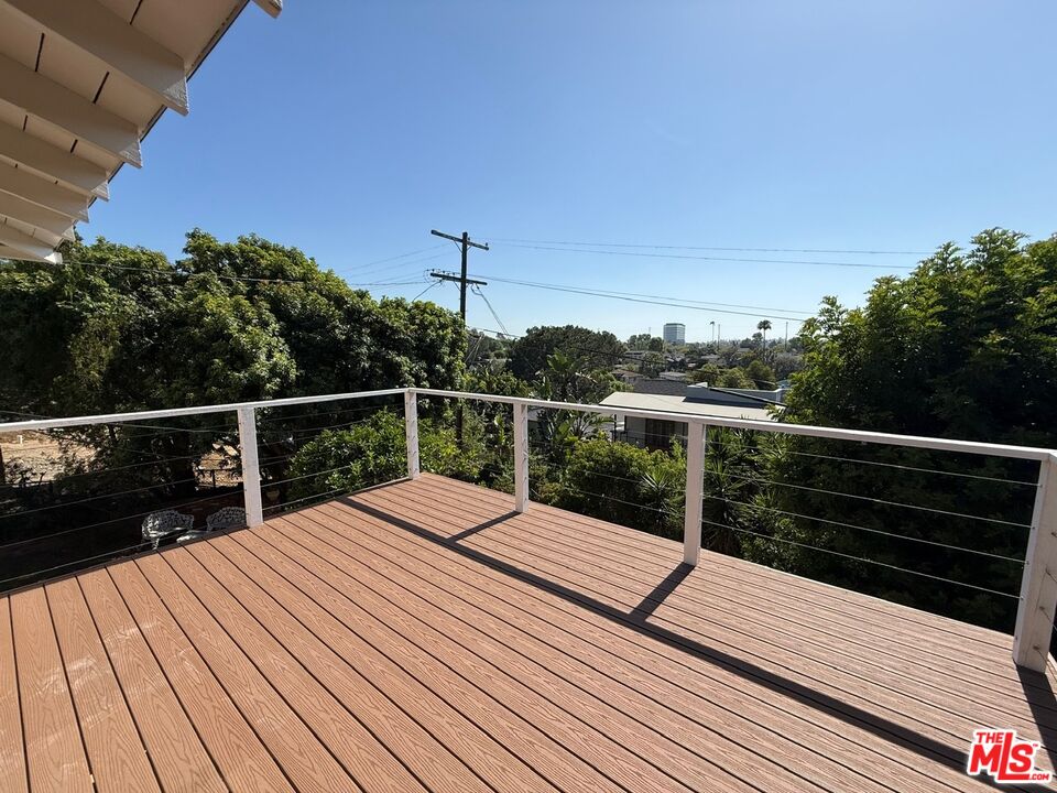 3237 Midvale Avenue Los Angeles, CA 90034 - Photo 13 of 24 a view of balcony with wooden floor and fence