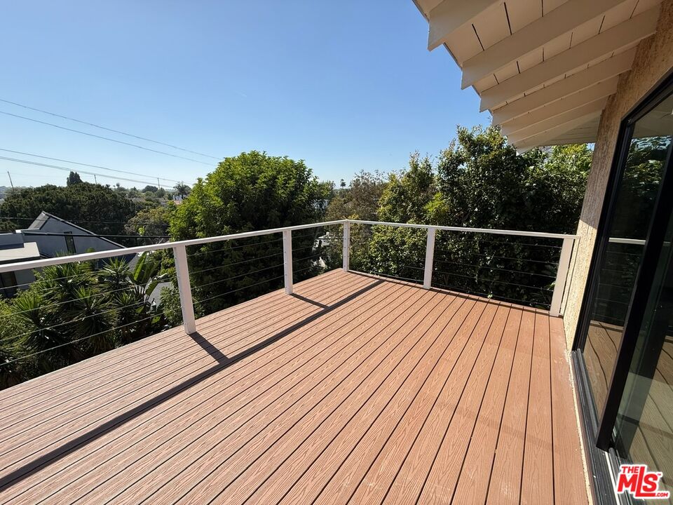 3237 Midvale Avenue Los Angeles, CA 90034 - Photo 14 of 24 a view of balcony with wooden floor and yard