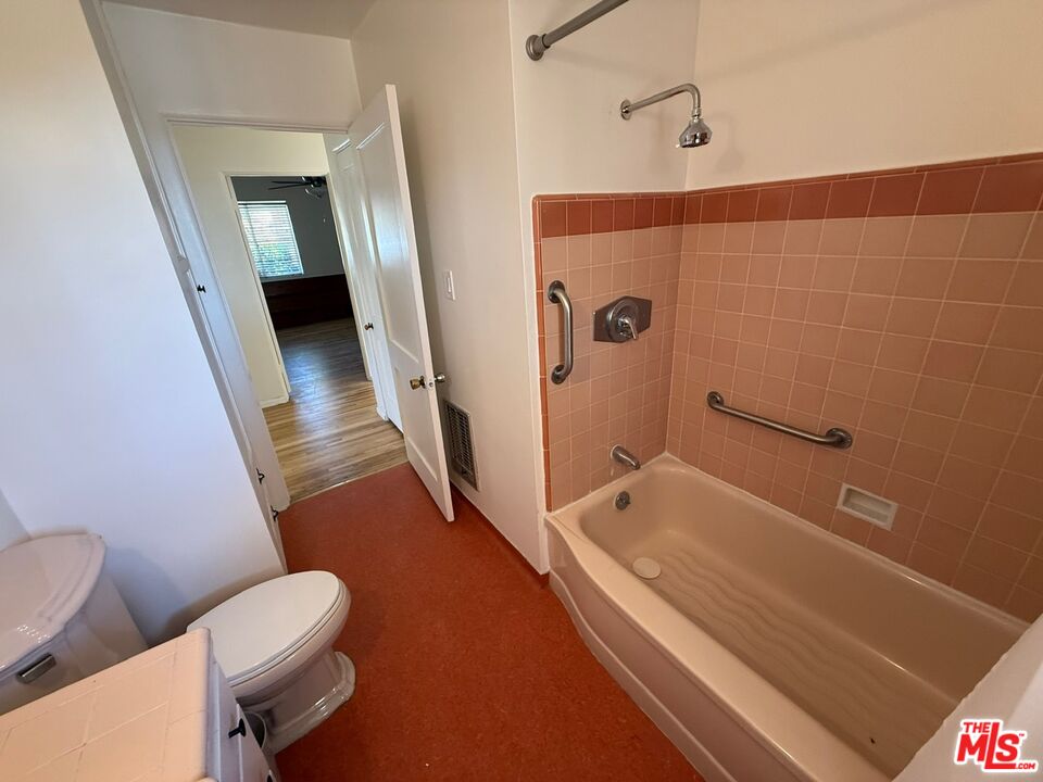 3237 Midvale Avenue Los Angeles, CA 90034 - Photo 16 of 24 a bathroom with a sink a toilet and shower