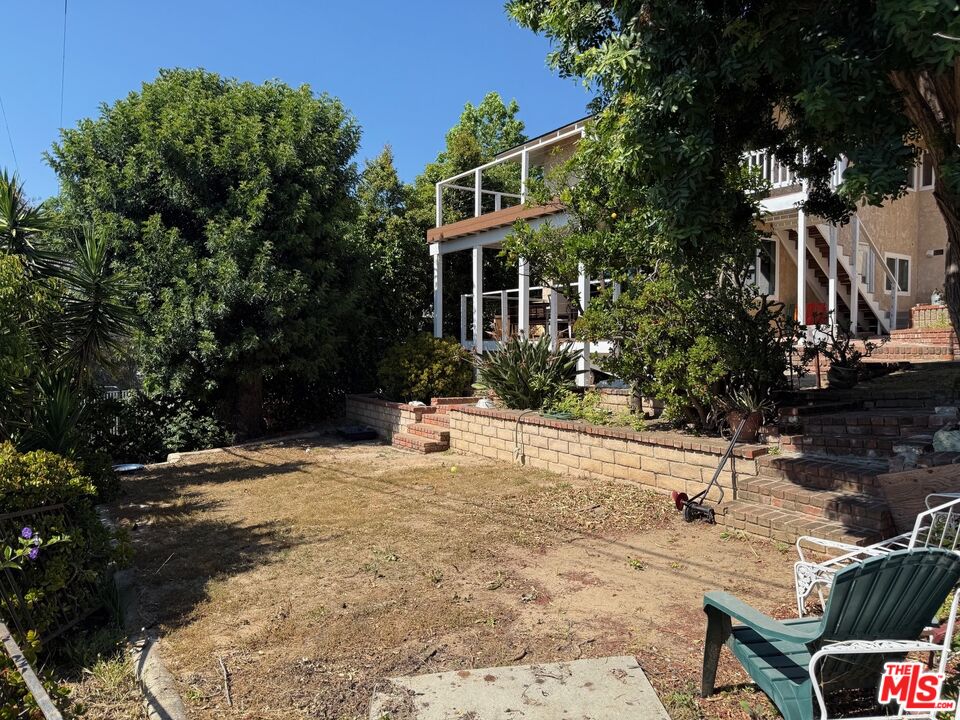 3237 Midvale Avenue Los Angeles, CA 90034 - Photo 22 of 24 a front view of a house with a yard