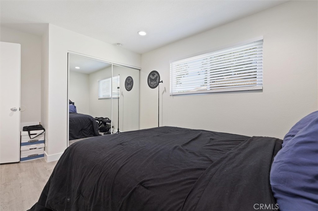 1723 Normandy Place, Unit D Santa Ana, CA 92705 - Photo 12 of 18 a bedroom with a bed and a cabinets