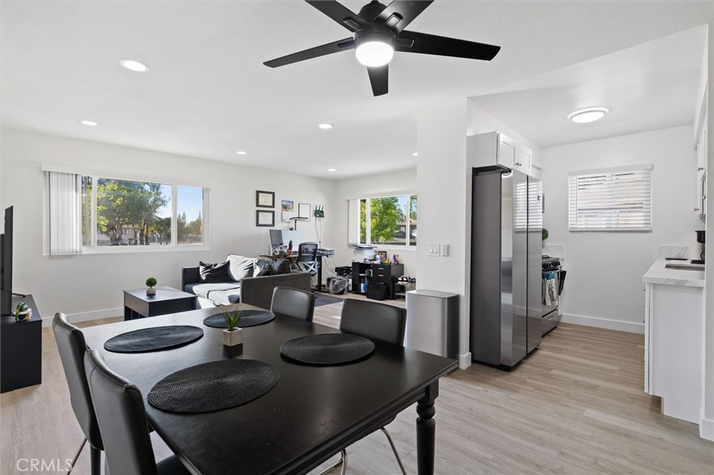 1723 Normandy Place, Unit D Santa Ana, CA 92705 - Photo 2 of 18 a view of a dining room with furniture window and wooden floor