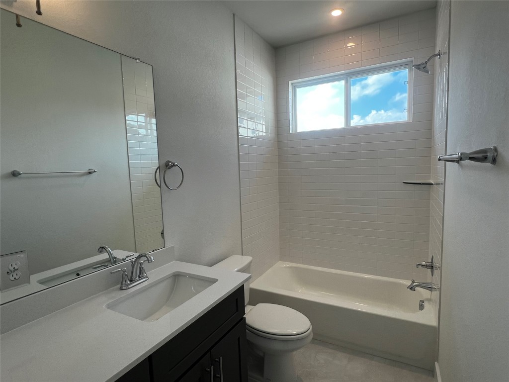 200 West 56th Street, Unit 5101 Austin, TX 78751 - Photo 10 of 14 a bathroom with a bathtub shower sink vanity mirror and toilet
