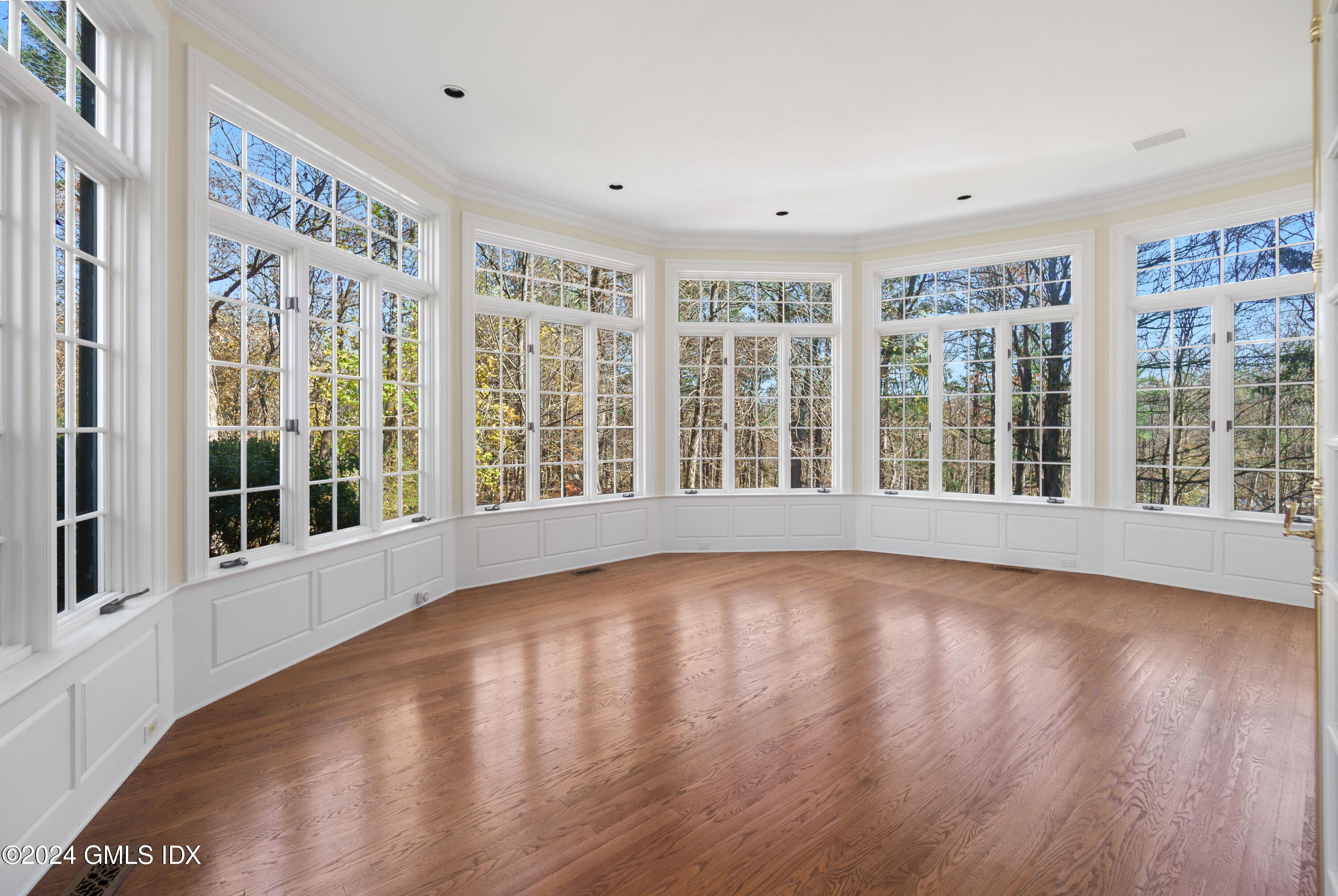534 Stanwich Road Greenwich, CT 06831 - Photo 12 of 30 a view of an empty room with wooden floor and a window