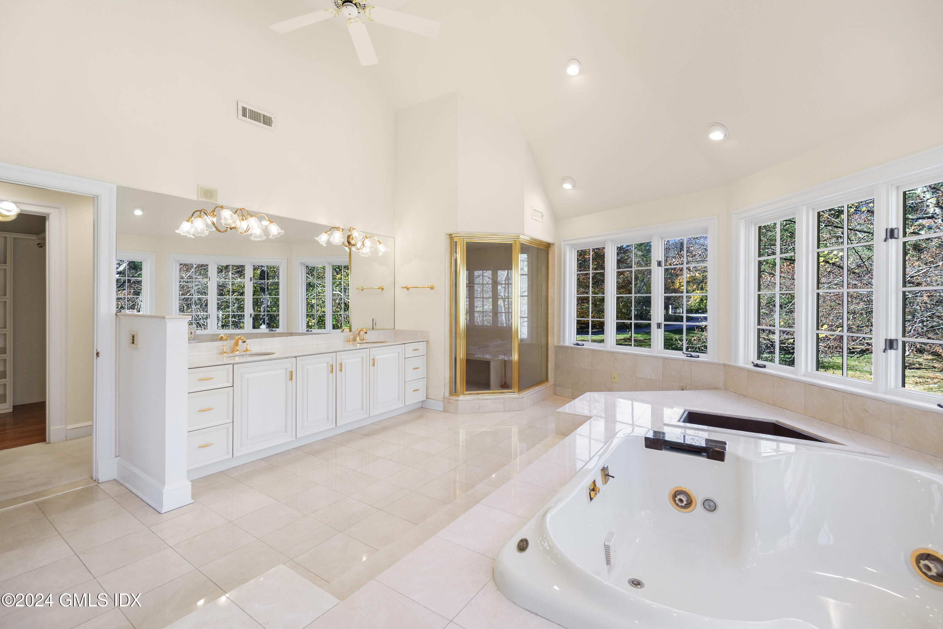 534 Stanwich Road Greenwich, CT 06831 - Photo 19 of 30 a large white bathroom with a large tub sink and shower