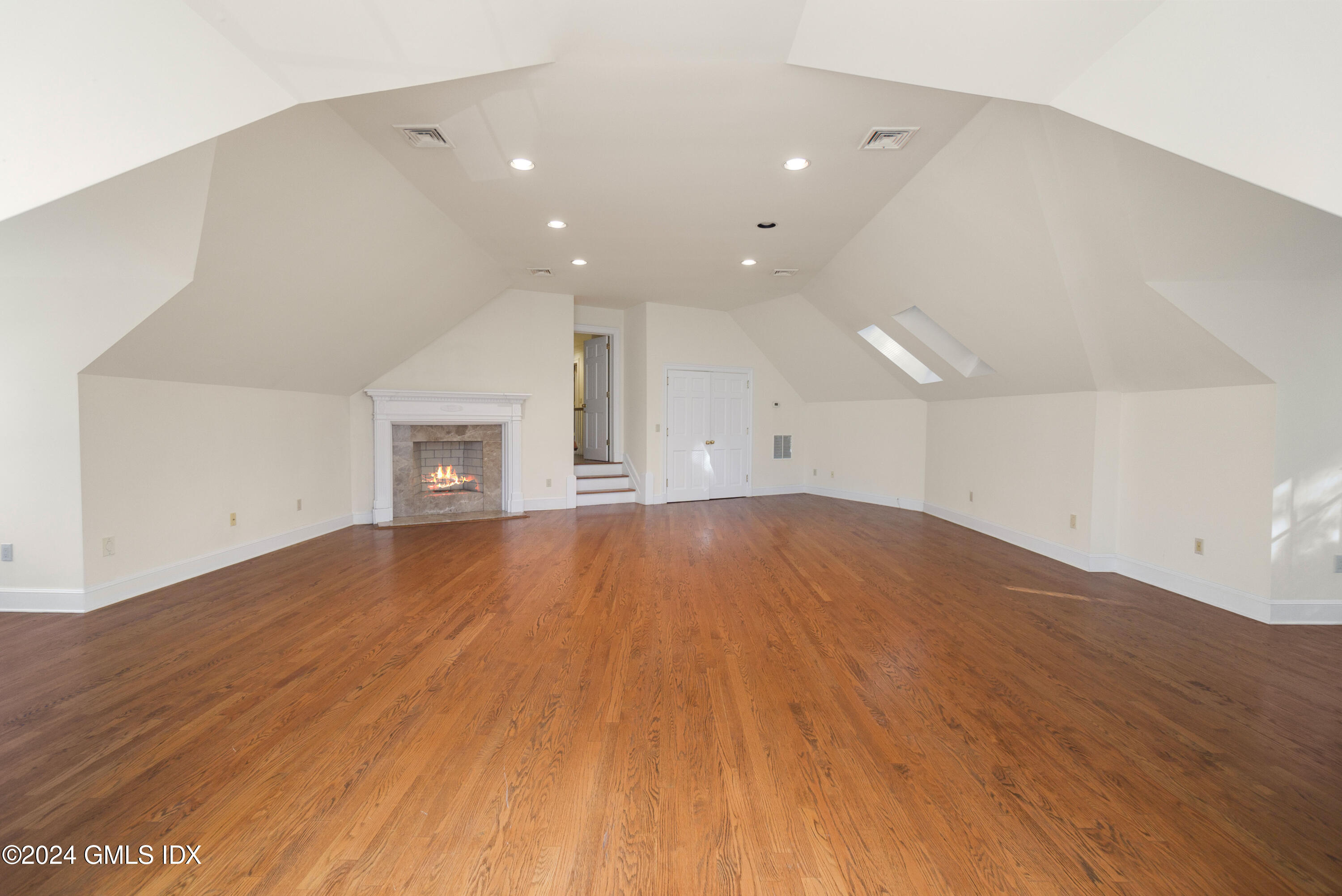 534 Stanwich Road Greenwich, CT 06831 - Photo 21 of 30 an empty room with wooden floor and a window
