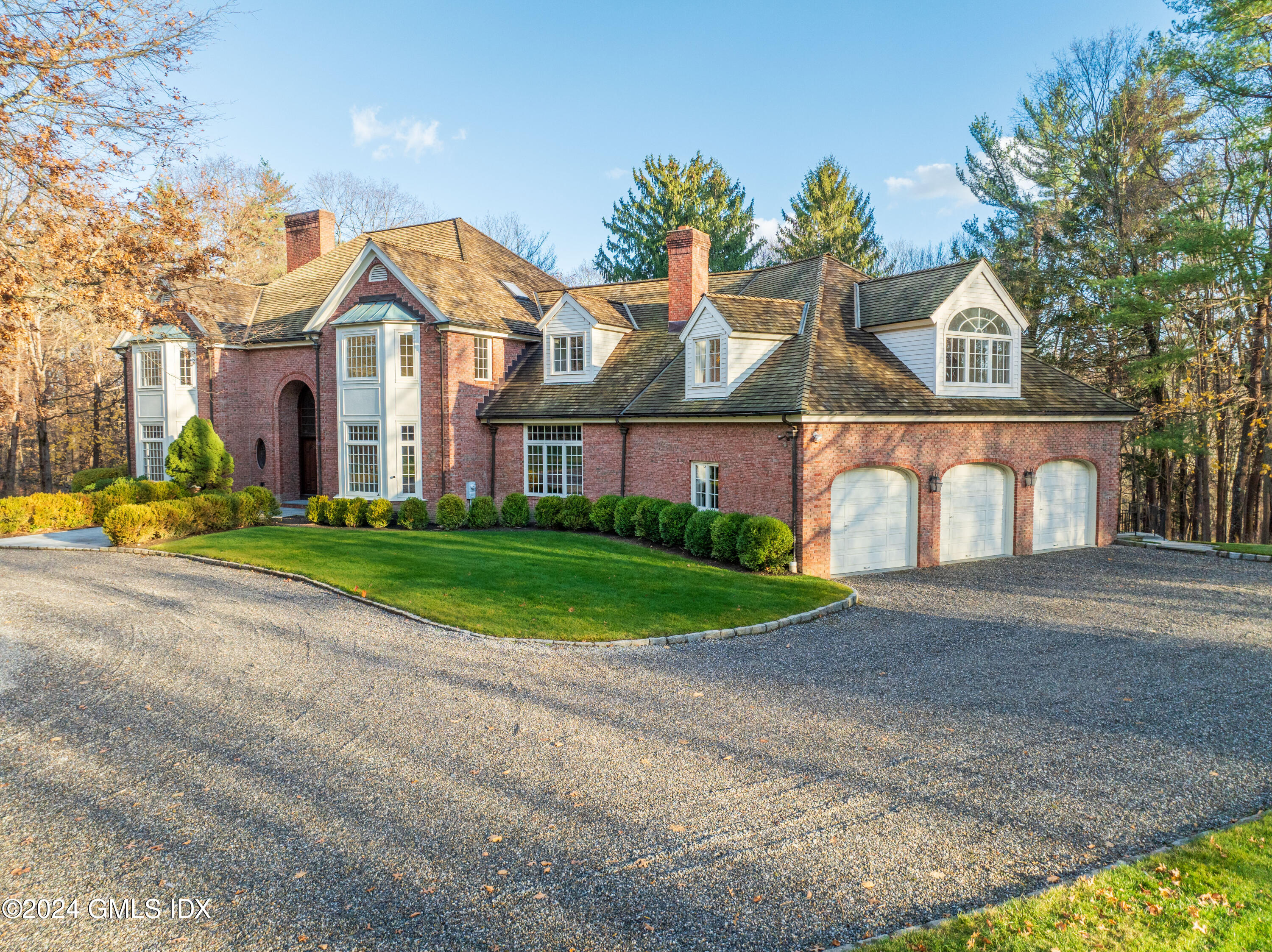 534 Stanwich Road Greenwich, CT 06831 - Photo 5 of 30 a front view of house with yard and green space