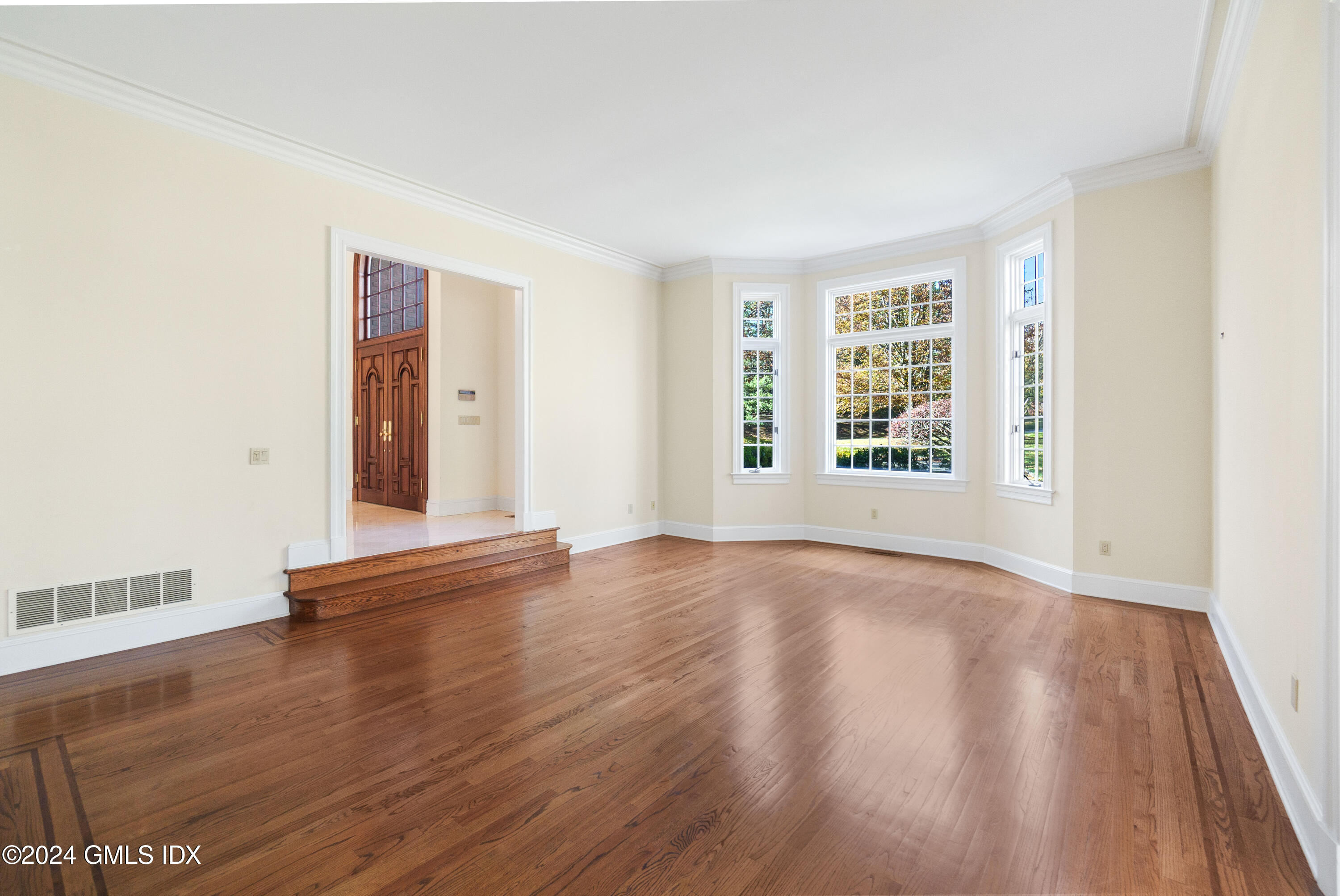 534 Stanwich Road Greenwich, CT 06831 - Photo 7 of 30 an empty room with wooden floor and windows