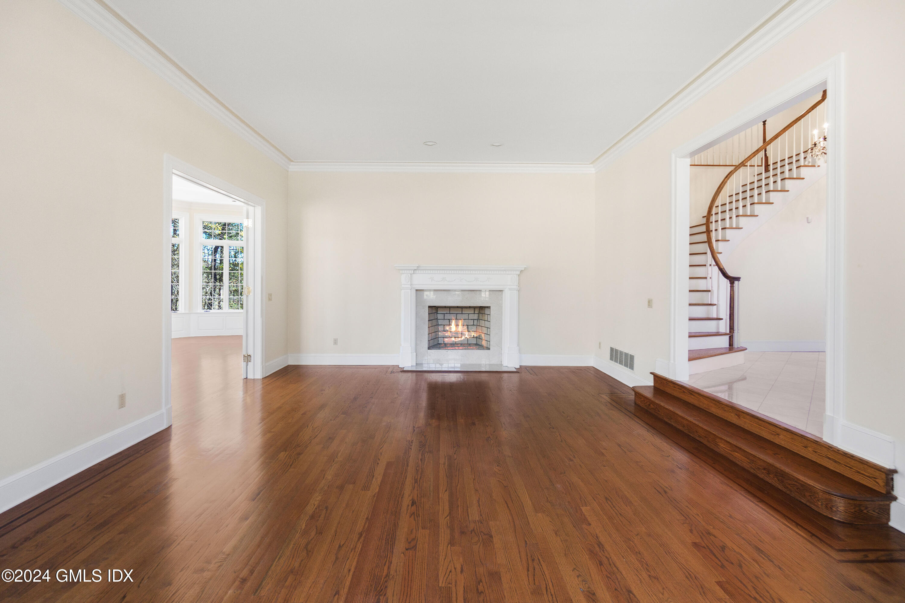 534 Stanwich Road Greenwich, CT 06831 - Photo 8 of 30 a view of an empty room with wooden floor and a window