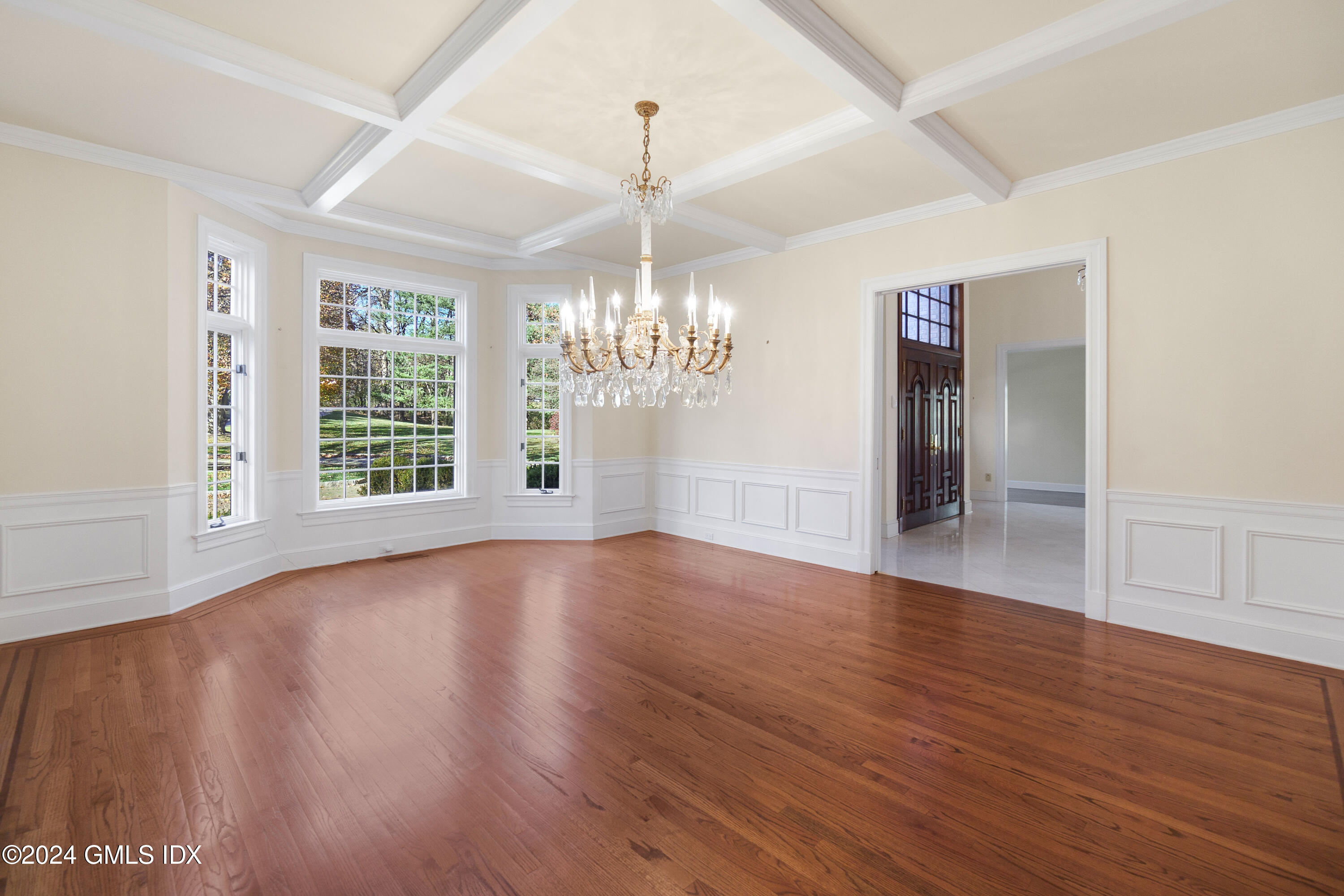 534 Stanwich Road Greenwich, CT 06831 - Photo 9 of 30 a view of an empty room with wooden floor and a window