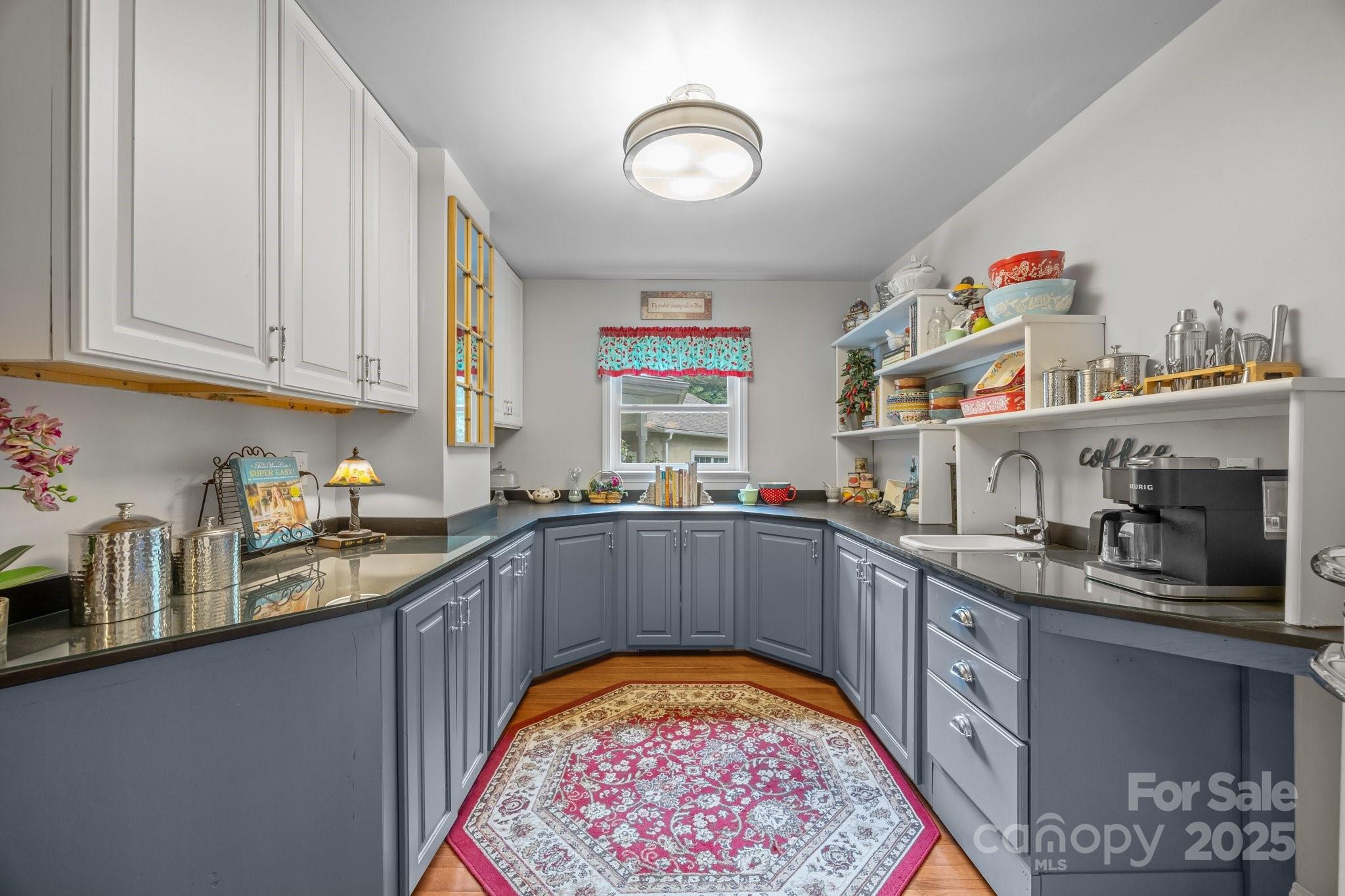 235 Kinder Lane Canton, NC 28716 - Photo 11 of 48 a kitchen with stainless steel appliances granite countertop a sink and cabinets