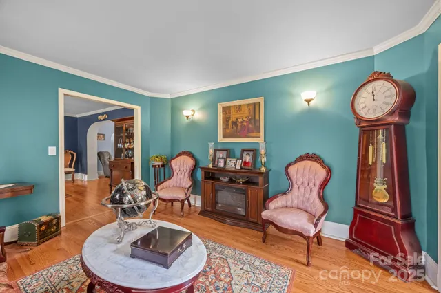 a living room with furniture and a mirror
