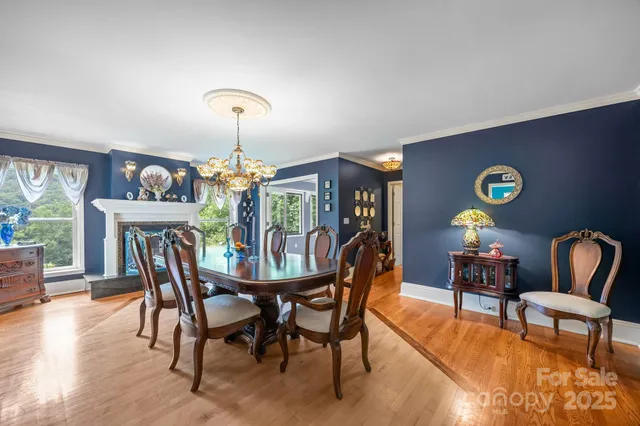 a dining room with furniture a window and a chandelier