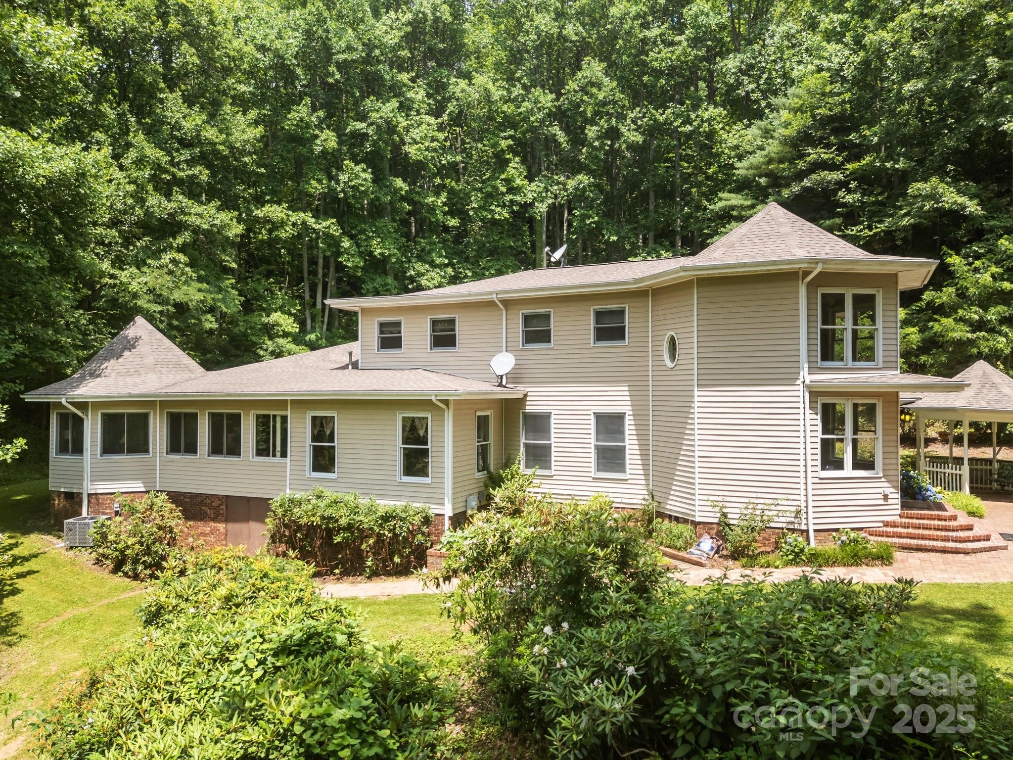 235 Kinder Lane Canton, NC 28716 - Photo 2 of 48 a front view of a house with a yard