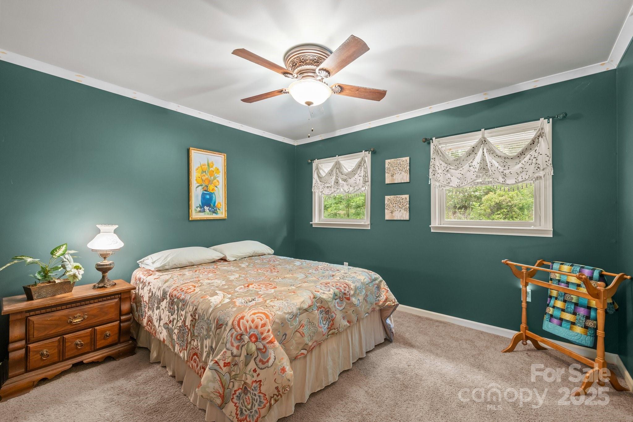 235 Kinder Lane Canton, NC 28716 - Photo 30 of 48 a bedroom with a bed and window