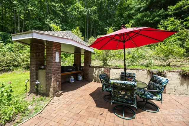 a view of a porch with chairs and plants