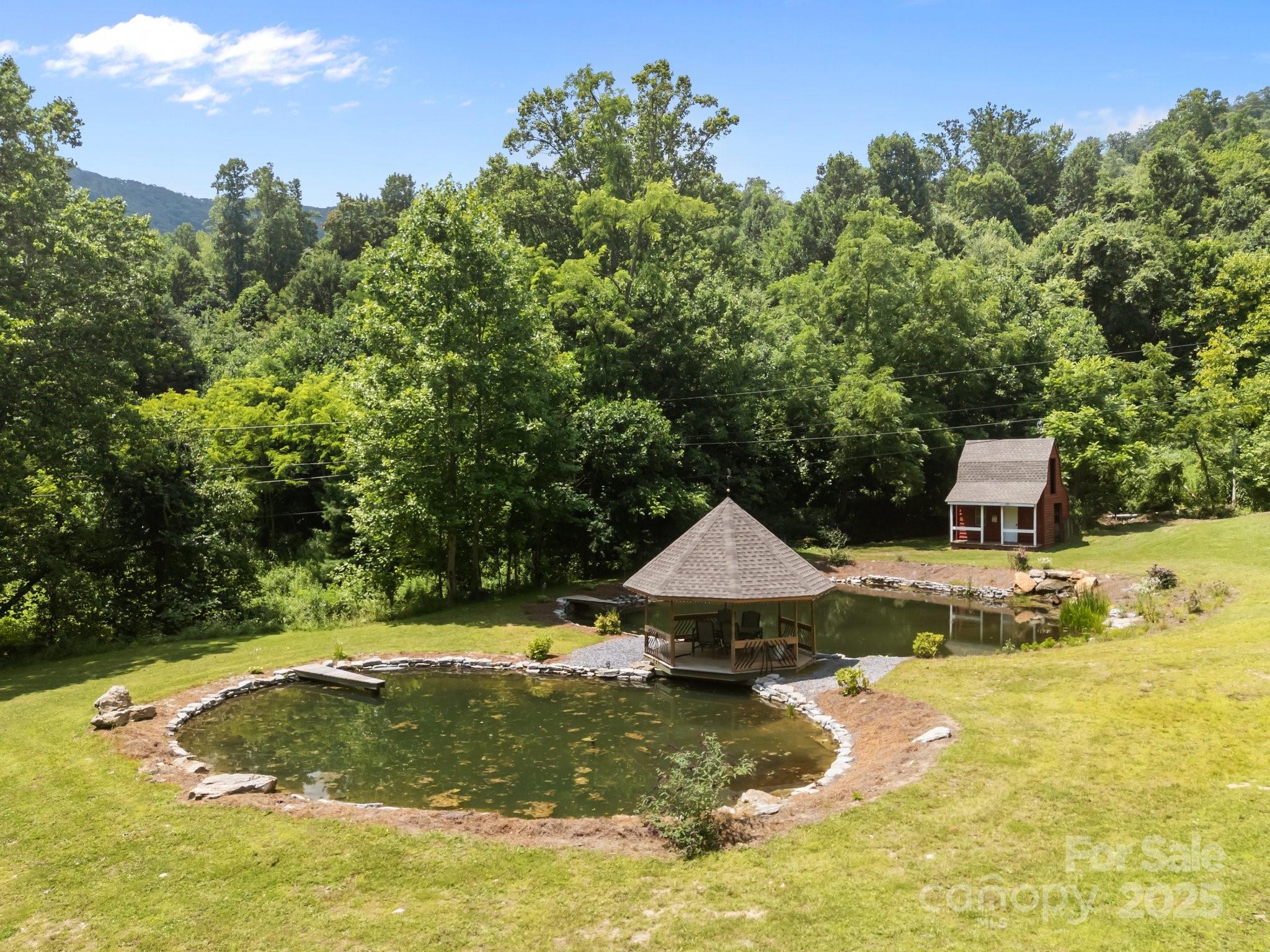 235 Kinder Lane Canton, NC 28716 - Photo 40 of 48 a backyard of a house with yard and trampoline
