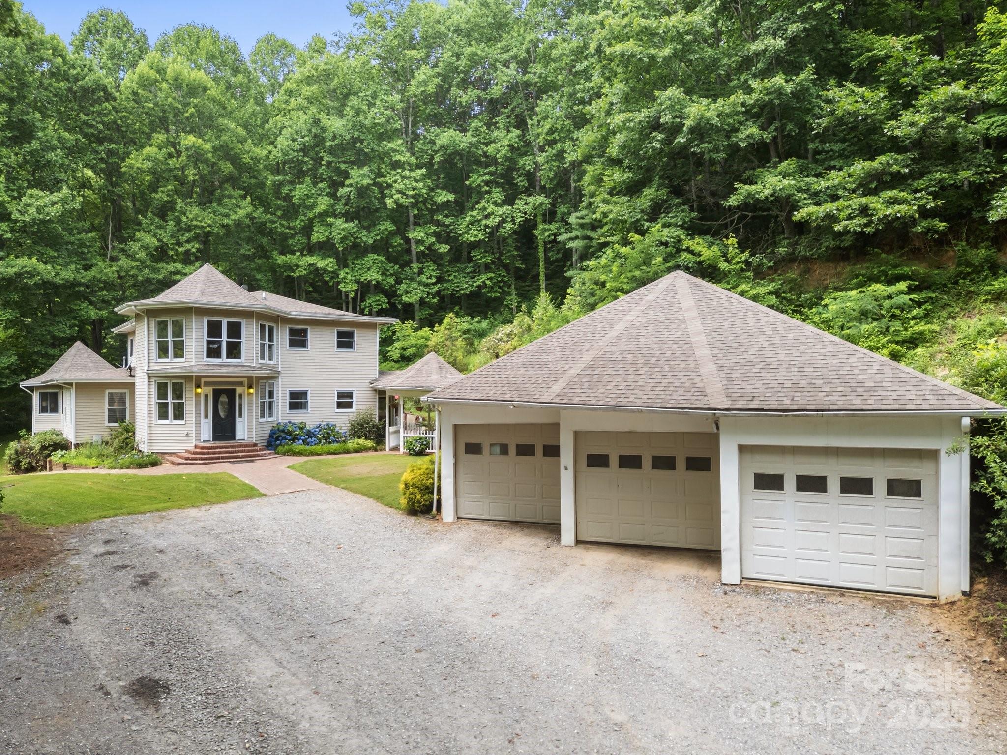 235 Kinder Lane Canton, NC 28716 - Photo 4 of 48 a house with trees in the background