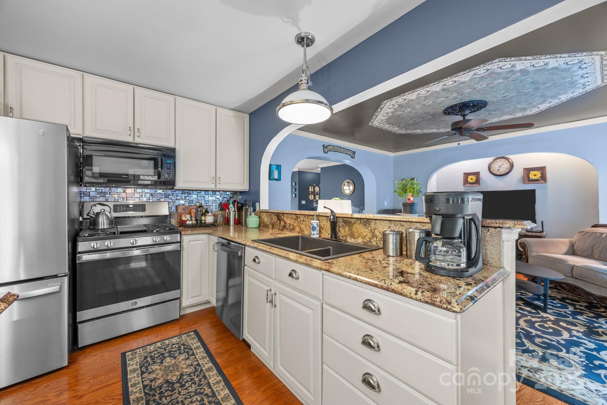 235 Kinder Lane Canton, NC 28716 - Photo 8 of 48 a kitchen with stainless steel appliances granite countertop a sink and a refrigerator