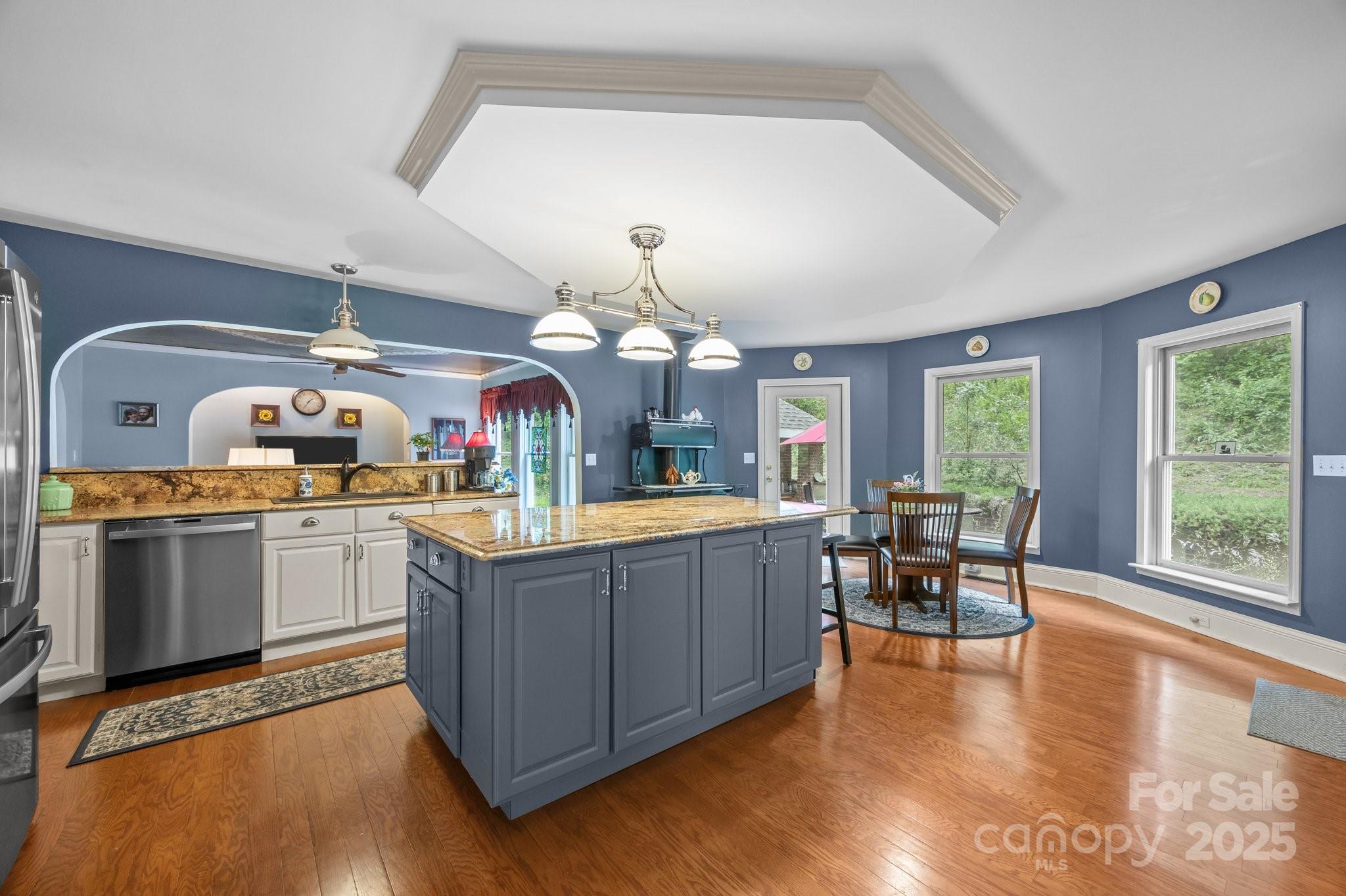 235 Kinder Lane Canton, NC 28716 - Photo 10 of 48 a kitchen with sink cabinets and wooden floor