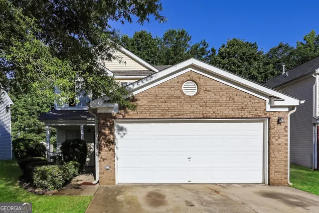 a house with trees in the background