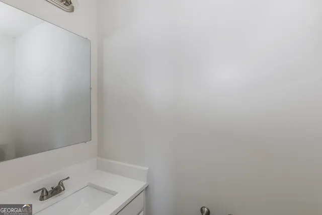 a bathroom with a sink and shower