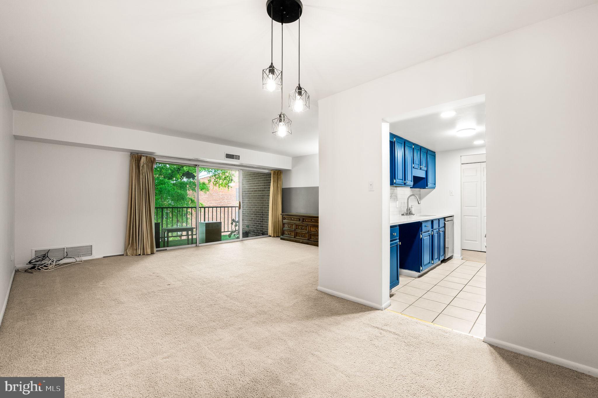 288 Drummers Lane, Unit 288 Wayne, PA 19087 - Photo 11 of 30 a view of livingroom with kitchen and window