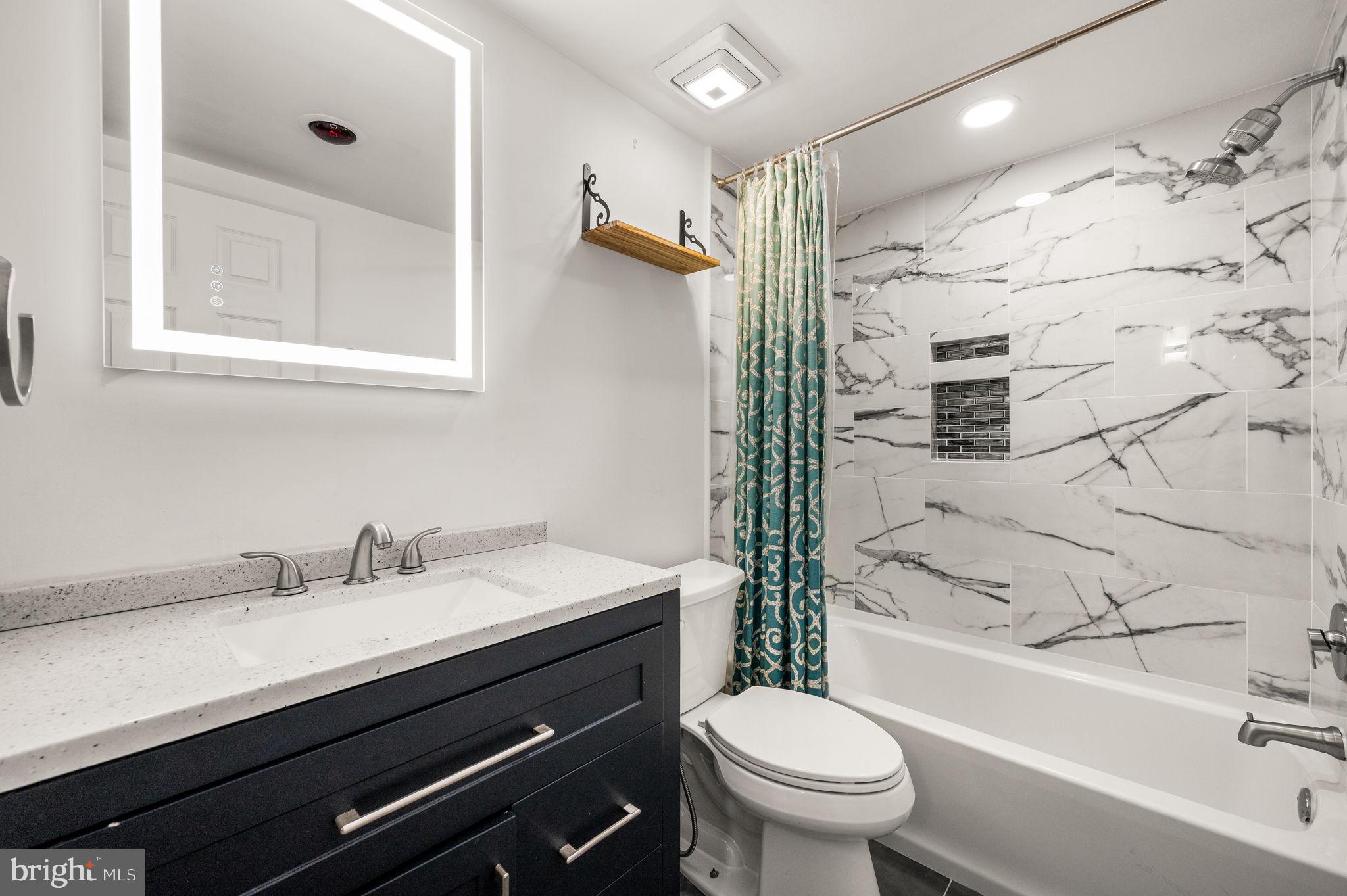 288 Drummers Lane, Unit 288 Wayne, PA 19087 - Photo 16 of 30 a bathroom with a sink toilet vanity and shower