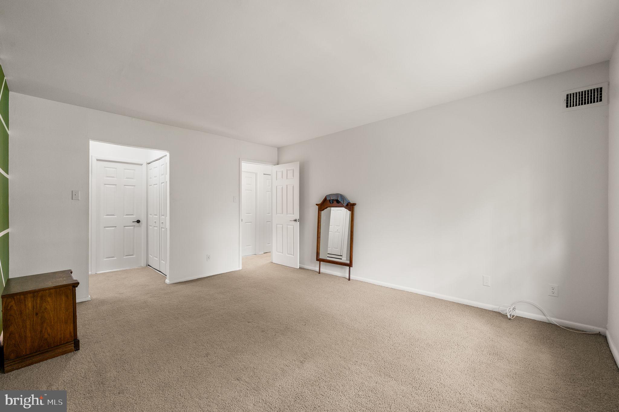 288 Drummers Lane, Unit 288 Wayne, PA 19087 - Photo 19 of 30 a view of an empty room with a fireplace