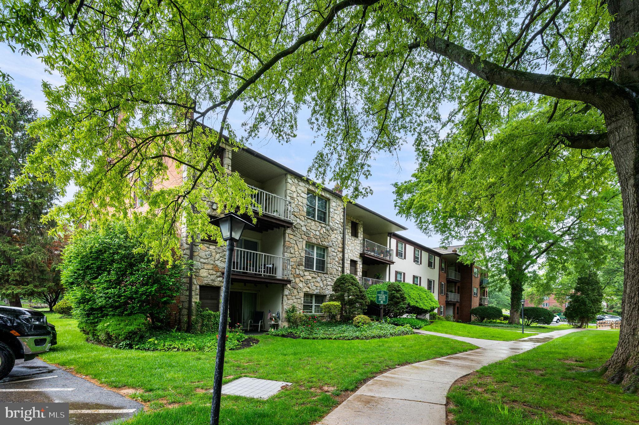 288 Drummers Lane, Unit 288 Wayne, PA 19087 - Photo 26 of 30 a front view of a house with a yard