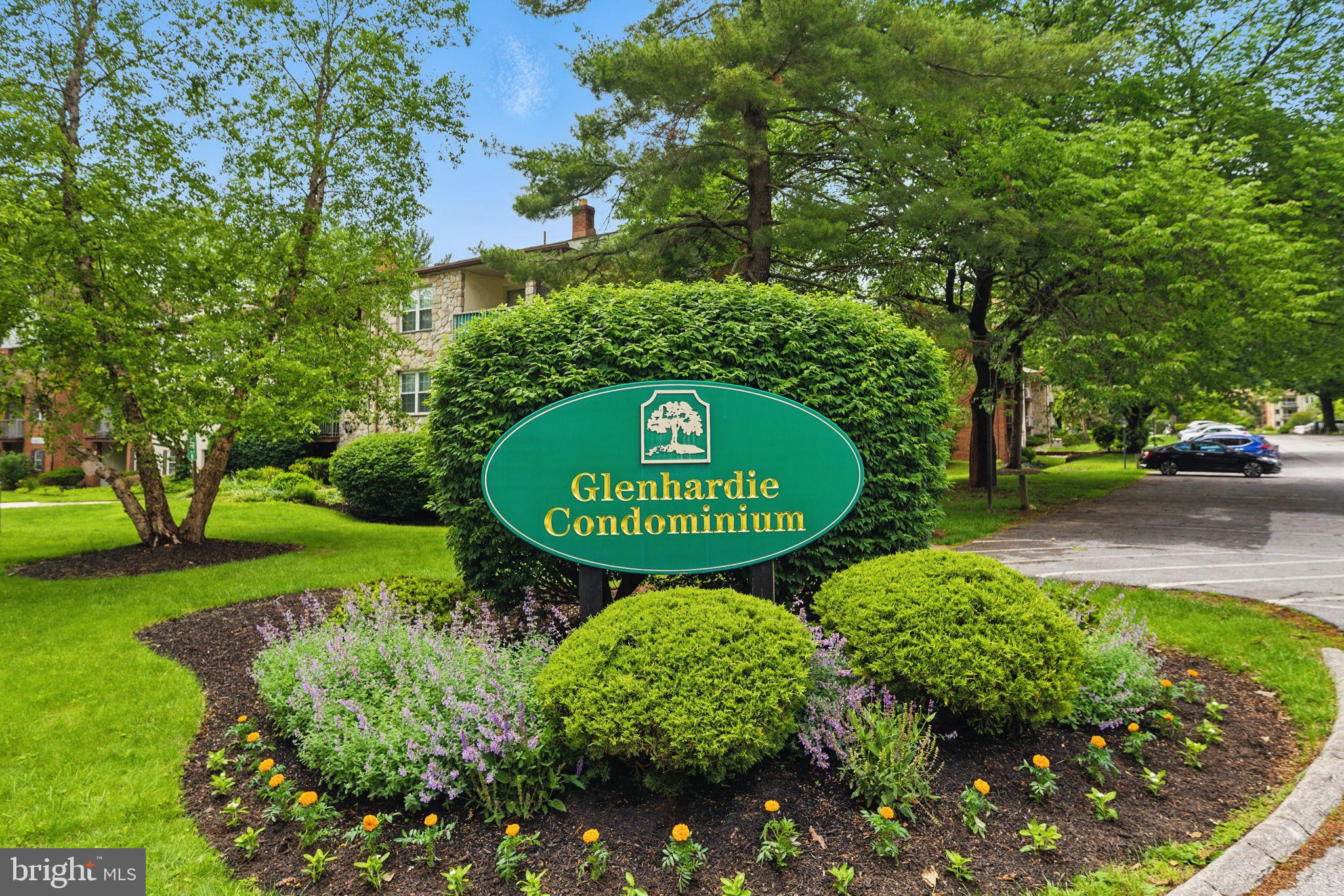 288 Drummers Lane, Unit 288 Wayne, PA 19087 - Photo 30 of 30 a sign that is sitting in front of flowers