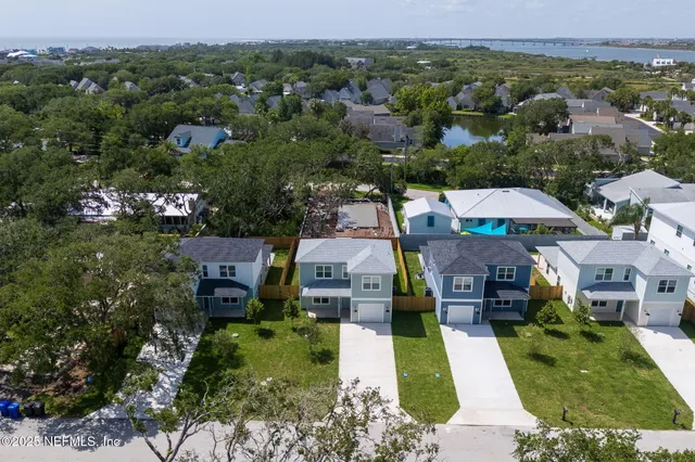 an aerial view of a house with a garden