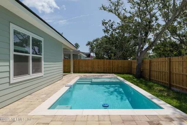 a view of backyard with green space