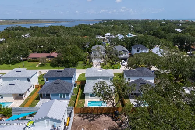 an aerial view of a house with a garden