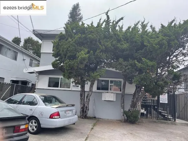 a front view of a house with parking space
