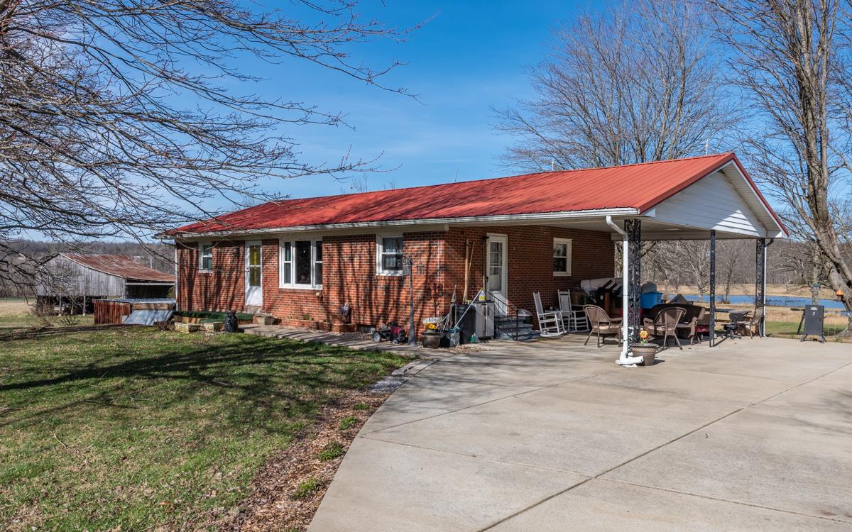 806 North Corinth Road Portland, TN 37148 - Photo 5 of 28 a view of a cafe with a table and chairs under an umbrella