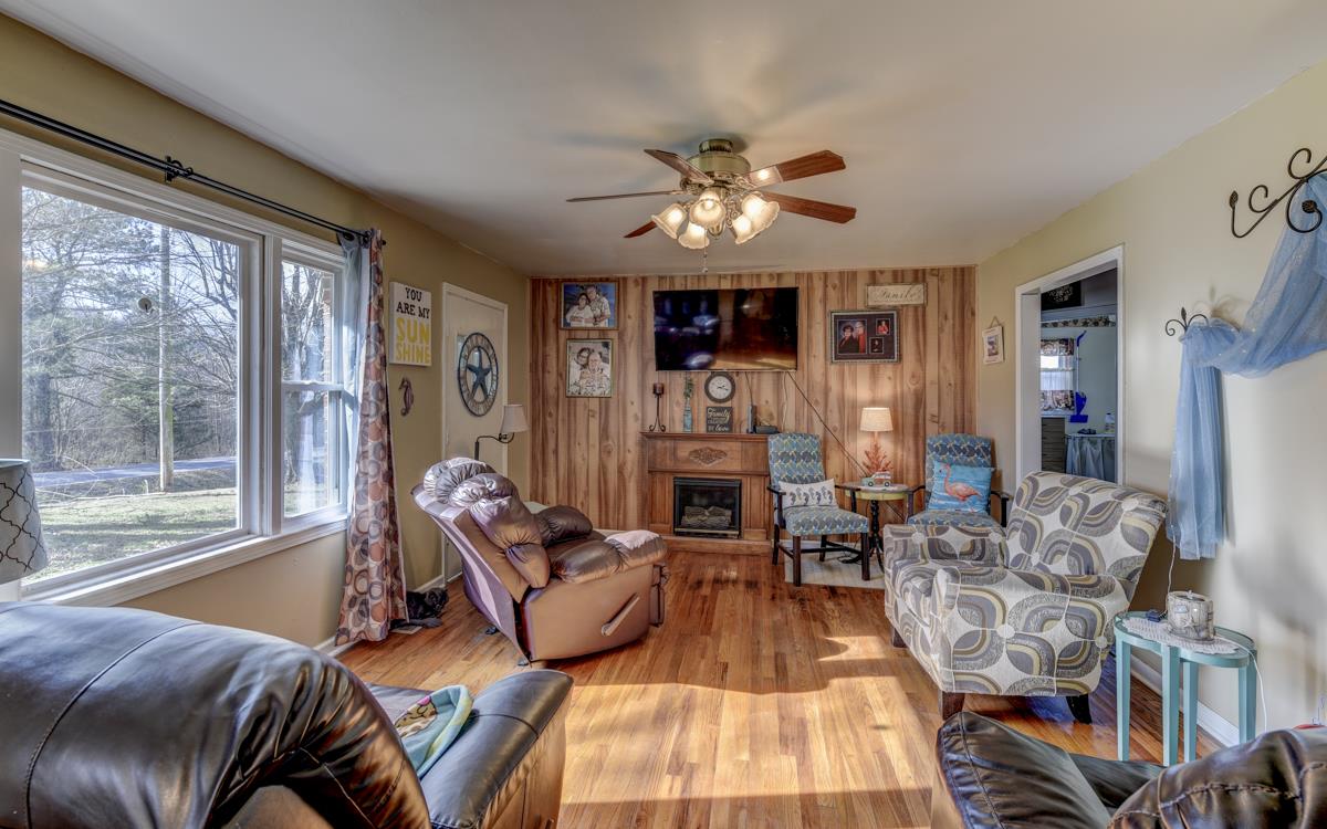 806 North Corinth Road Portland, TN 37148 - Photo 6 of 28 a living room with furniture fireplace and a large window