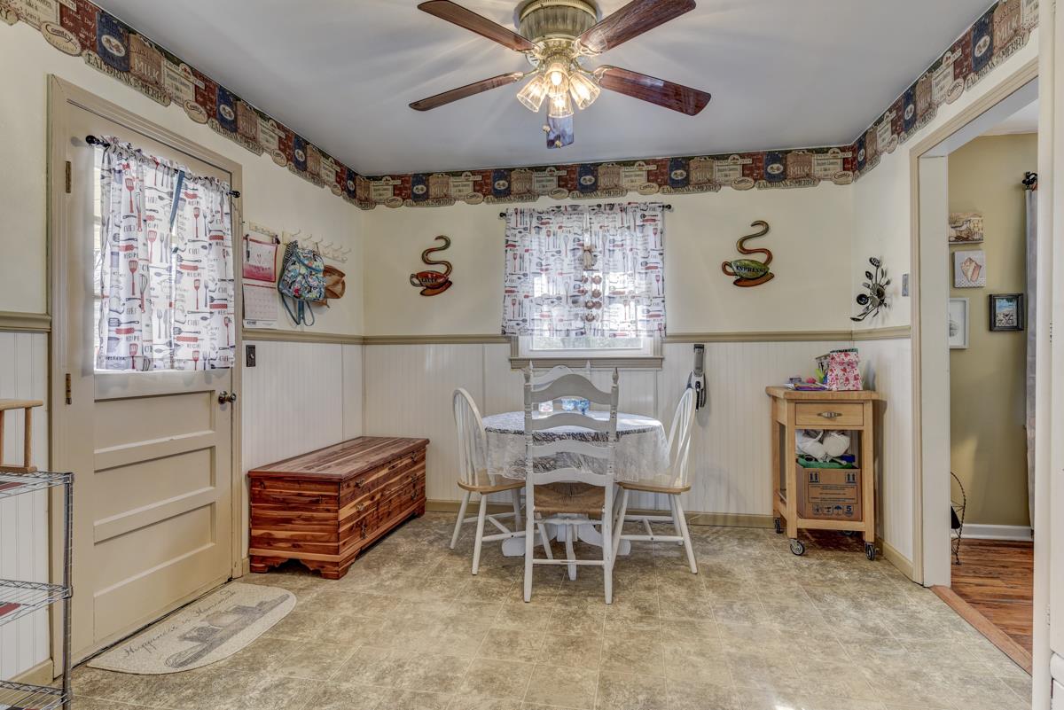 806 North Corinth Road Portland, TN 37148 - Photo 9 of 28 a view of a dining room with furniture and chandelier