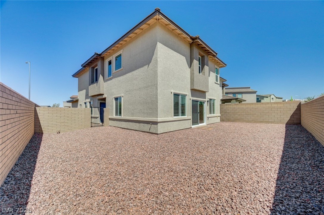 345 Isla Enclave Way Henderson, NV 89011 - Photo 72 of 75 This spacious backyard offers privacy and low maintenance landscaping.