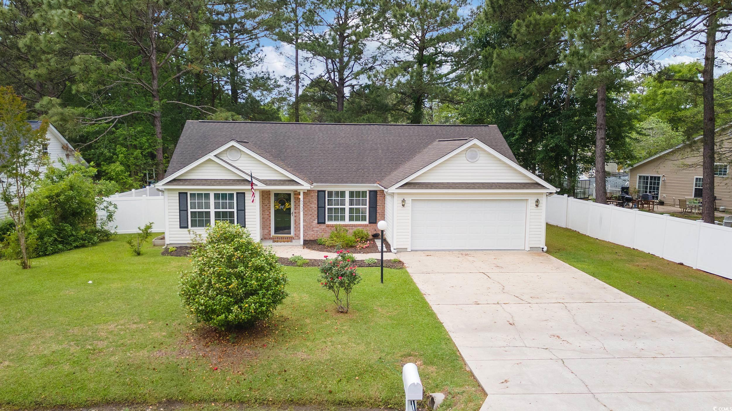 5933 Rahnavard Boulevard Myrtle Beach, SC 29588 - Photo 1 of 25 Ranch-style home featuring a garage, a shingled ro