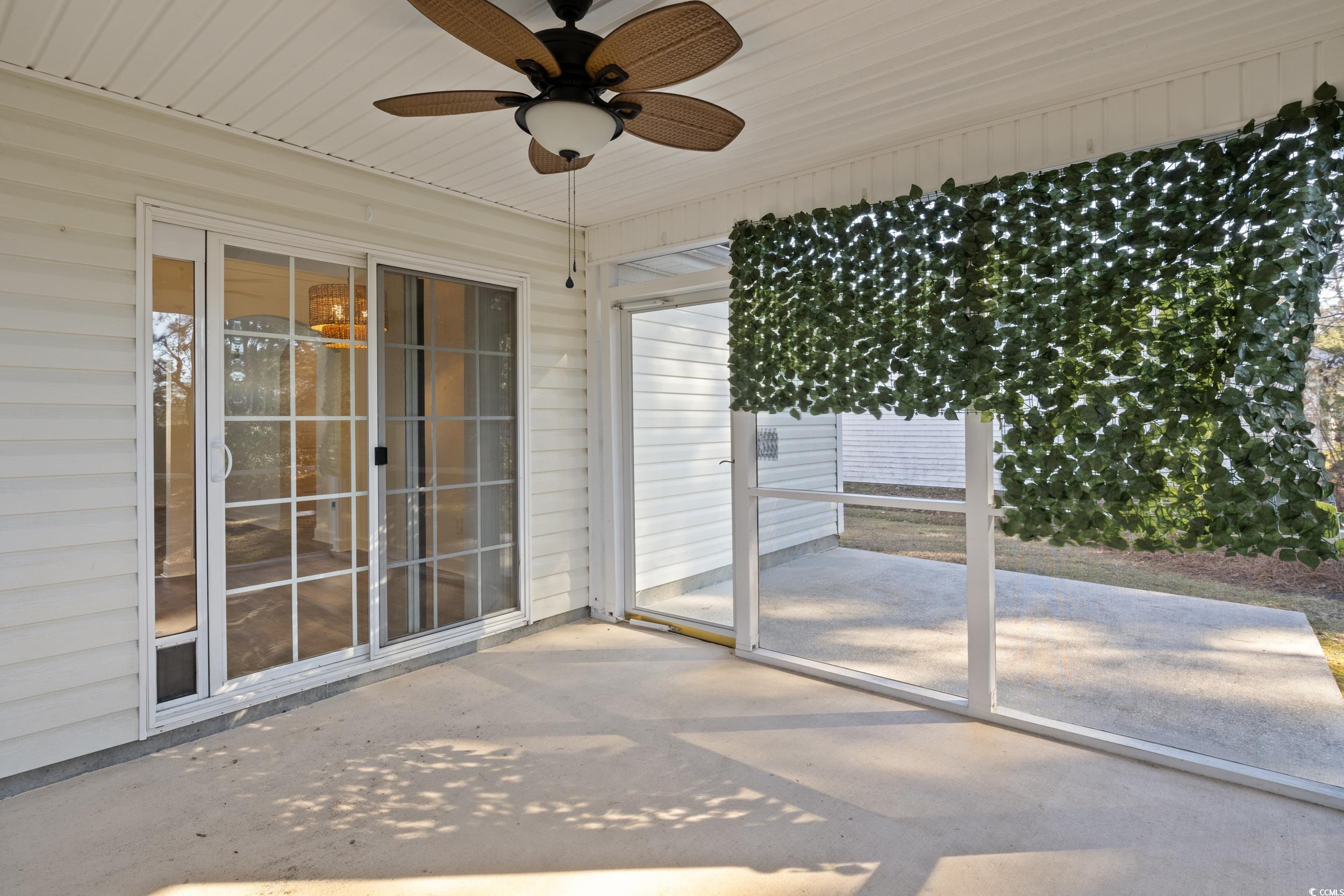 5933 Rahnavard Boulevard Myrtle Beach, SC 29588 - Photo 19 of 25 Unfurnished sunroom featuring ceiling fan