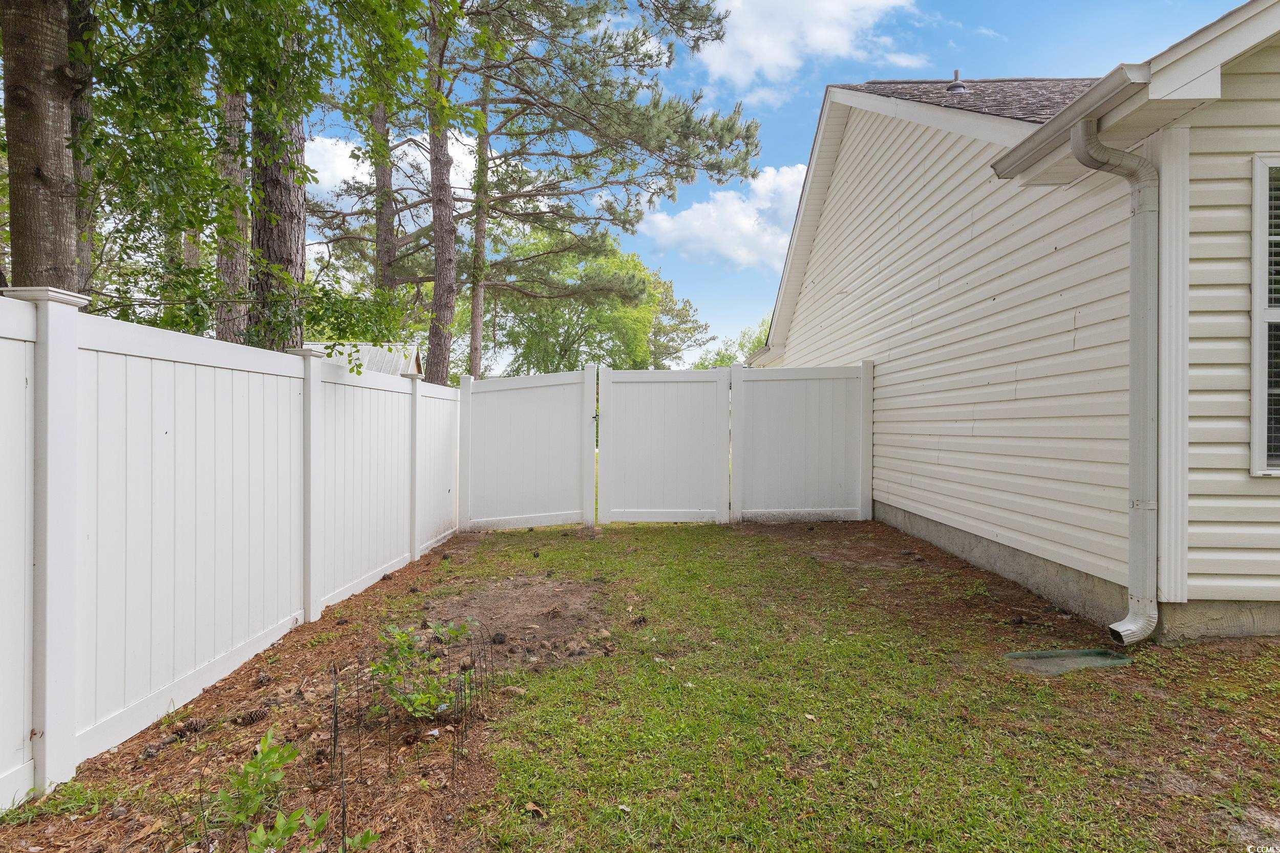 5933 Rahnavard Boulevard Myrtle Beach, SC 29588 - Photo 21 of 25 View of yard featuring fence