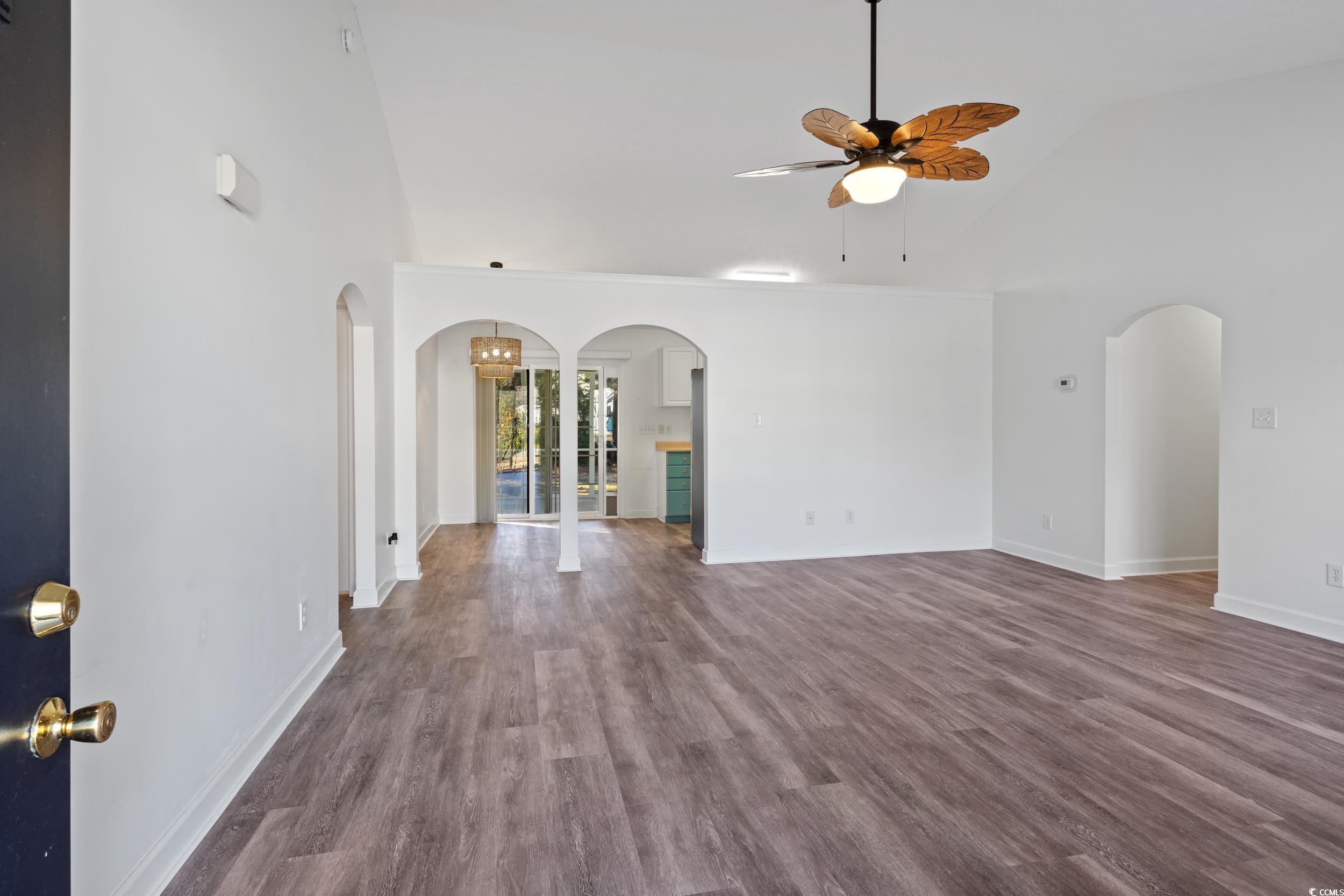5933 Rahnavard Boulevard Myrtle Beach, SC 29588 - Photo 6 of 25 Unfurnished living room with ceiling fan, hardwood