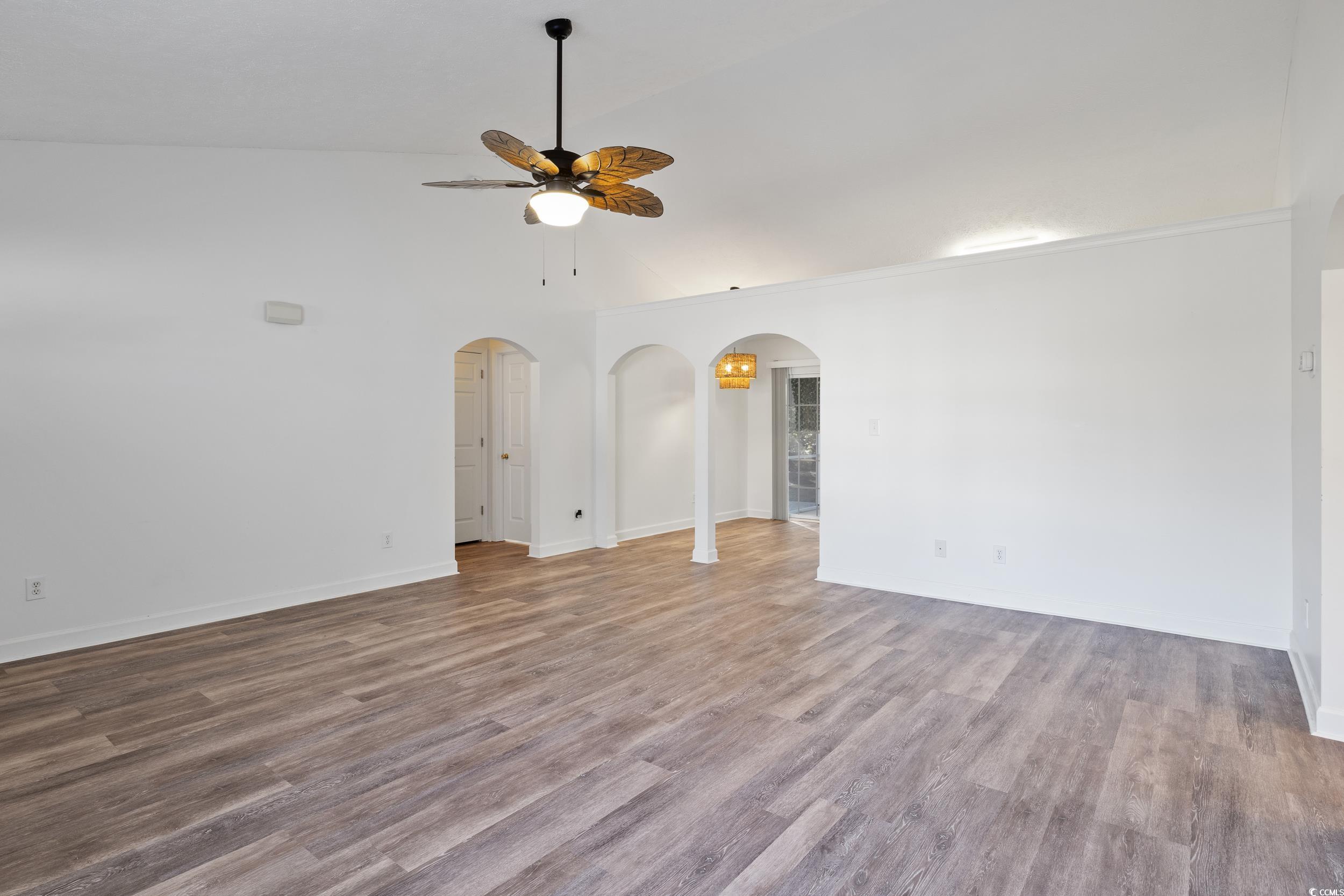 5933 Rahnavard Boulevard Myrtle Beach, SC 29588 - Photo 7 of 25 Unfurnished room with ceiling fan, vaulted ceiling