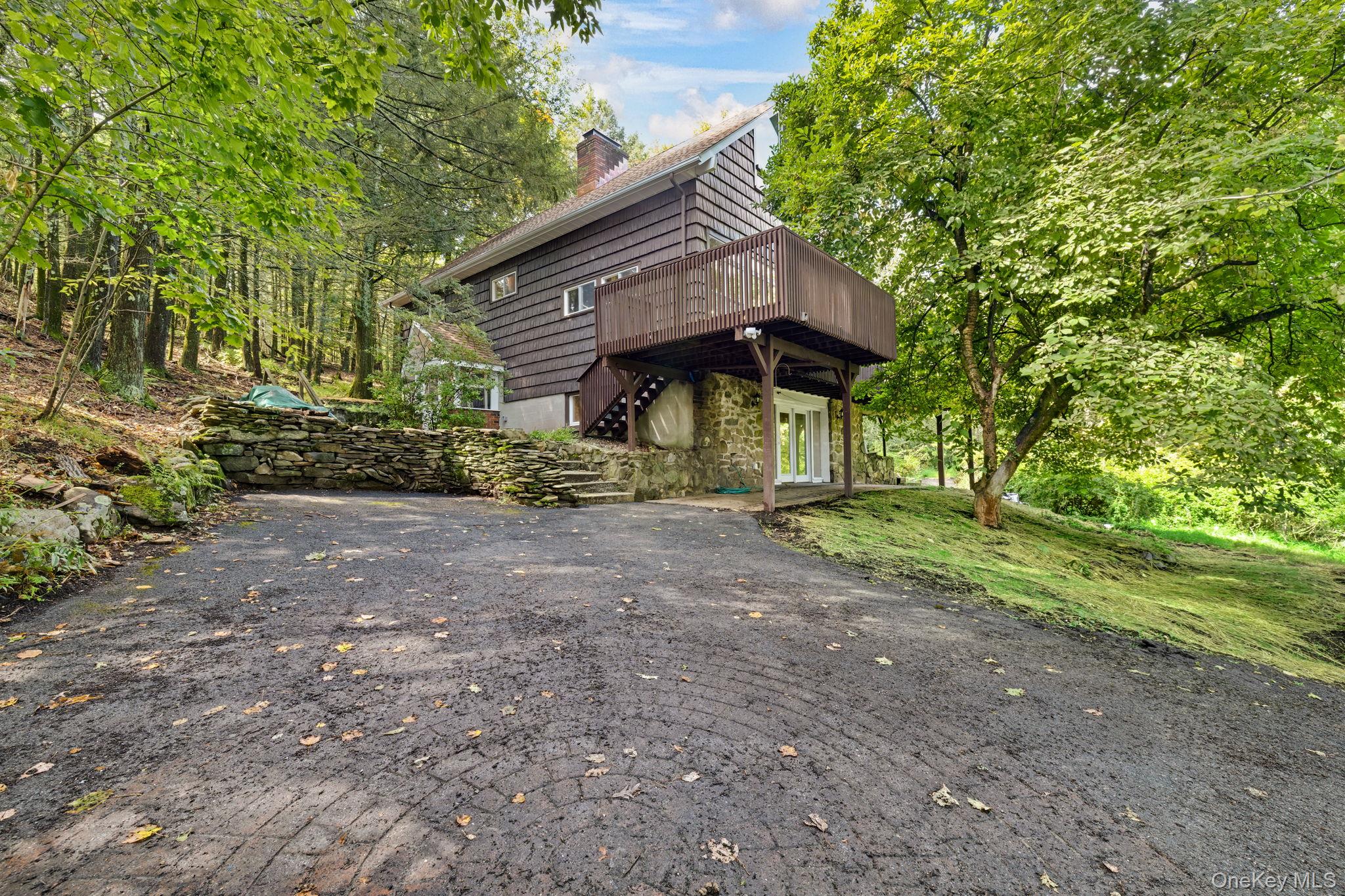 53 West Corbett Road Montgomery, NY 12549 - Photo 30 of 41 View of property exterior with a wooden deck, a chimney, and stairway