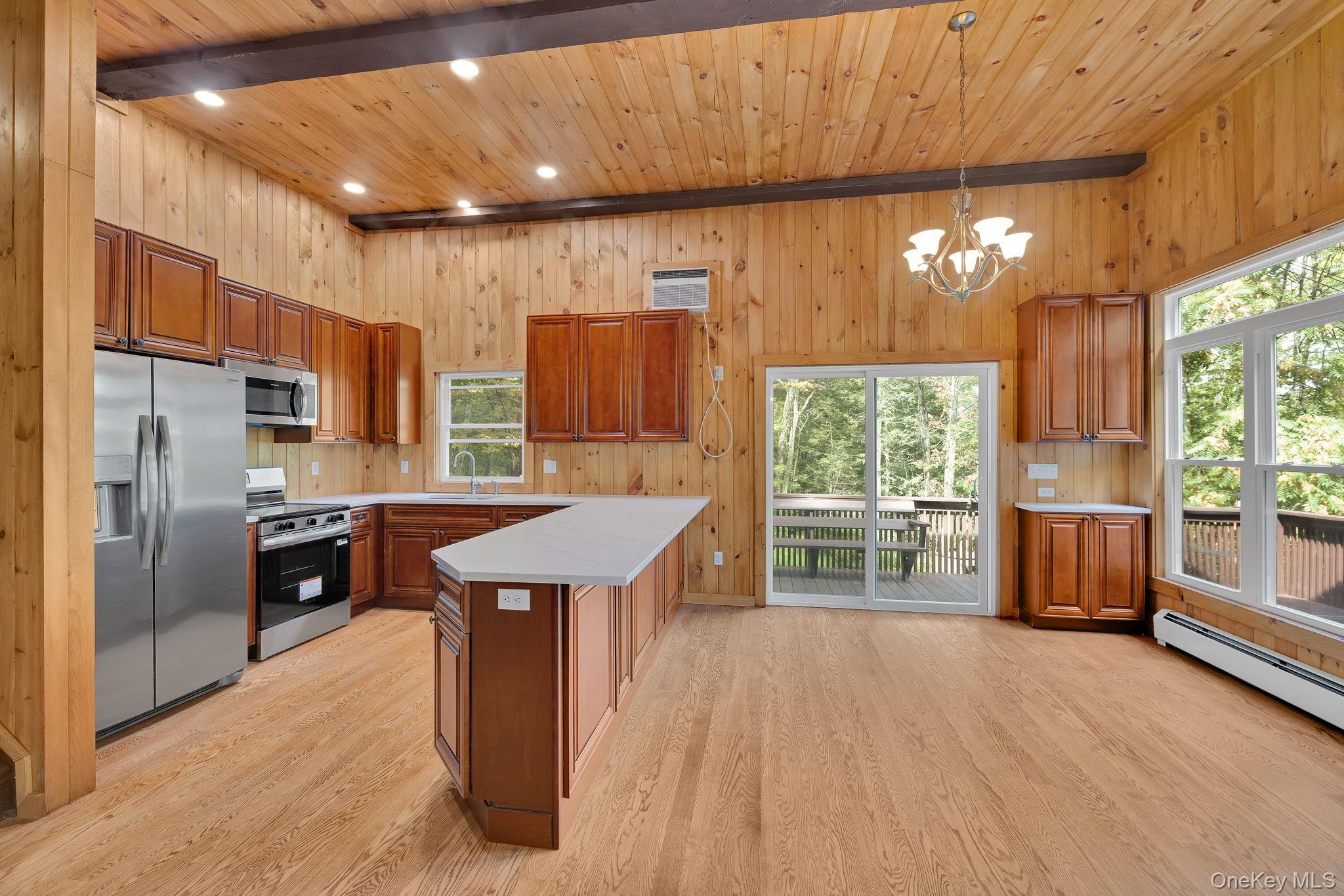 53 West Corbett Road Montgomery, NY 12549 - Photo 6 of 41 Kitchen with wooden ceiling with exposed beams, a peninsula, recessed lighting and stainless steel appliances Level 3