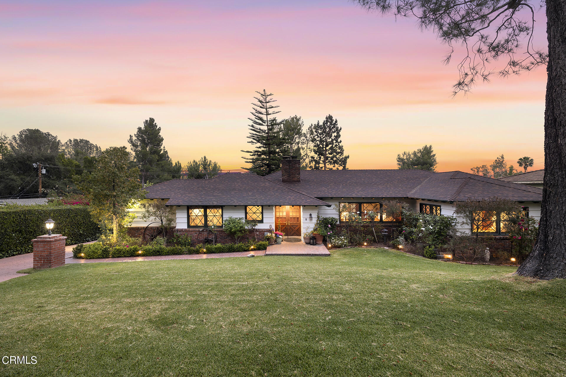 2100 Pinecrest Drive Altadena, CA 91001 - Photo 1 of 6 a front view of a house with a garden and lake view