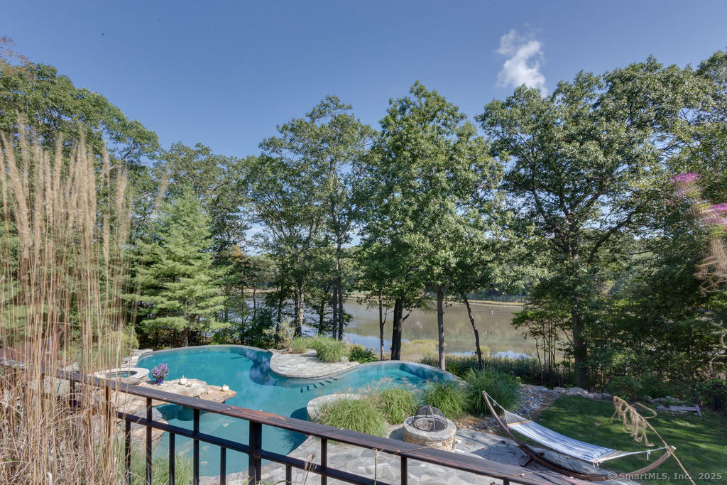 76 Sachem Head Road Guilford, CT 06437 - Photo 2 of 40 a view of yard from deck having patio