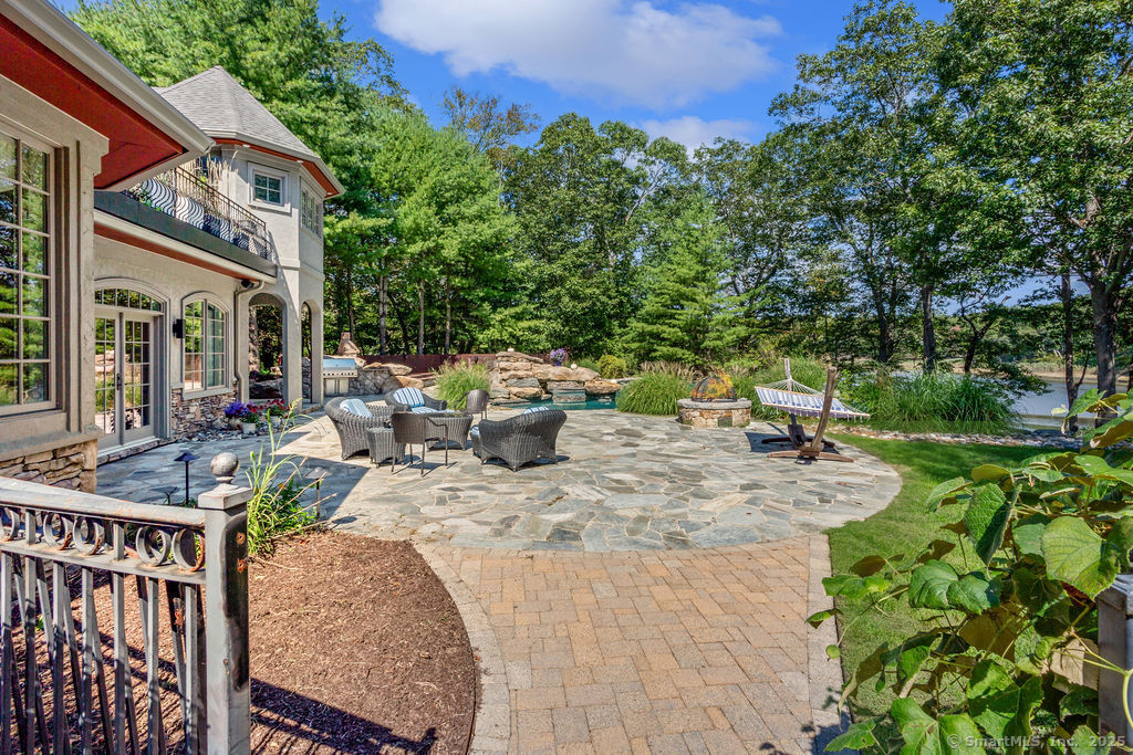 76 Sachem Head Road Guilford, CT 06437 - Photo 33 of 40 a view of backyard with swimming pool and outdoor seating