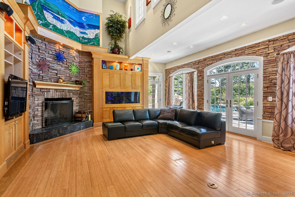 76 Sachem Head Road Guilford, CT 06437 - Photo 9 of 40 a living room with furniture and a fireplace